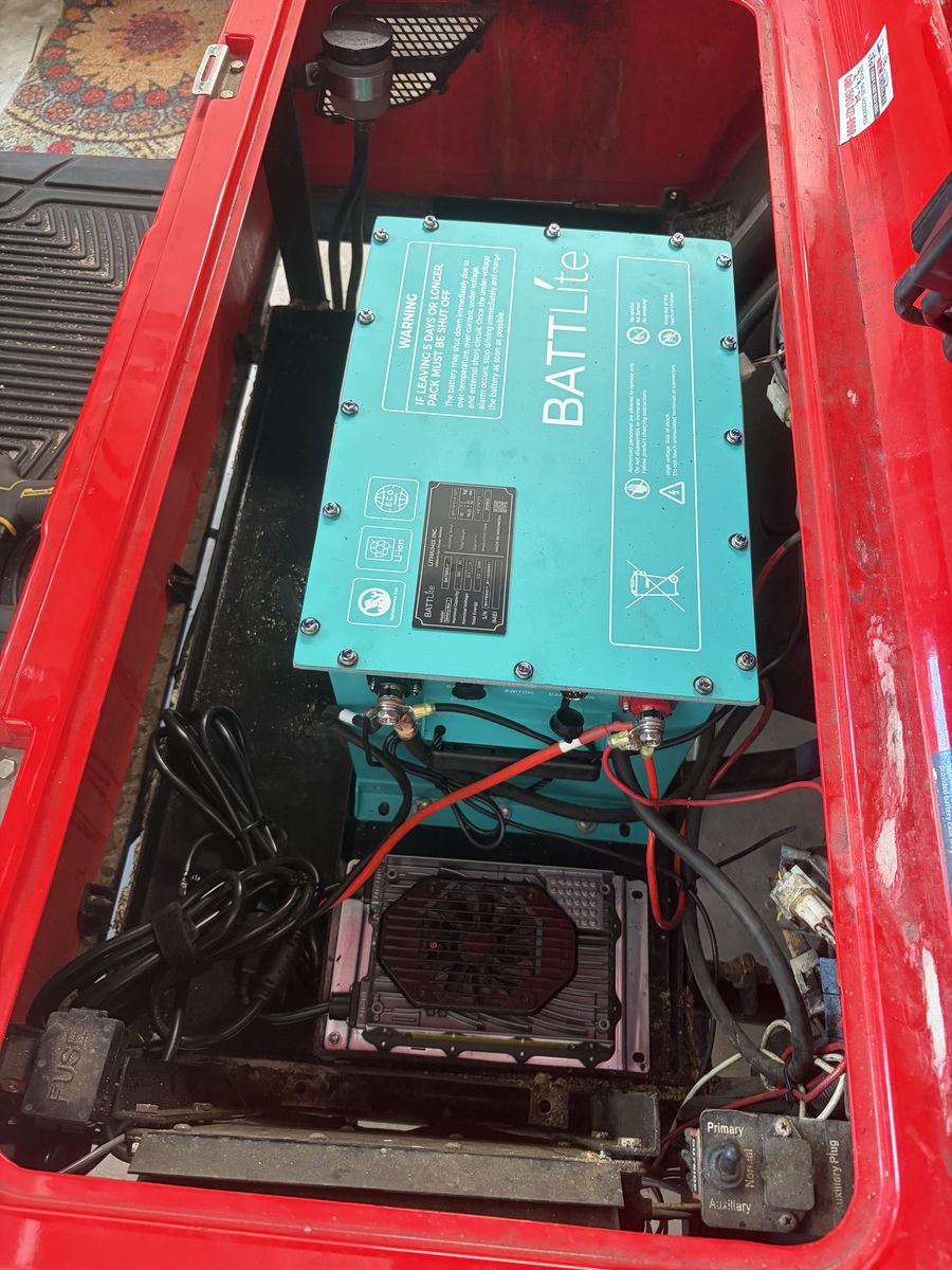 Clean premium lithium battery pack installed in a golf cart